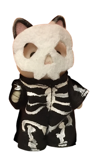 cat dressed as a skeleton